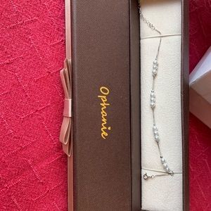 New.  NEVER WORN. Silver and pearl bracelet